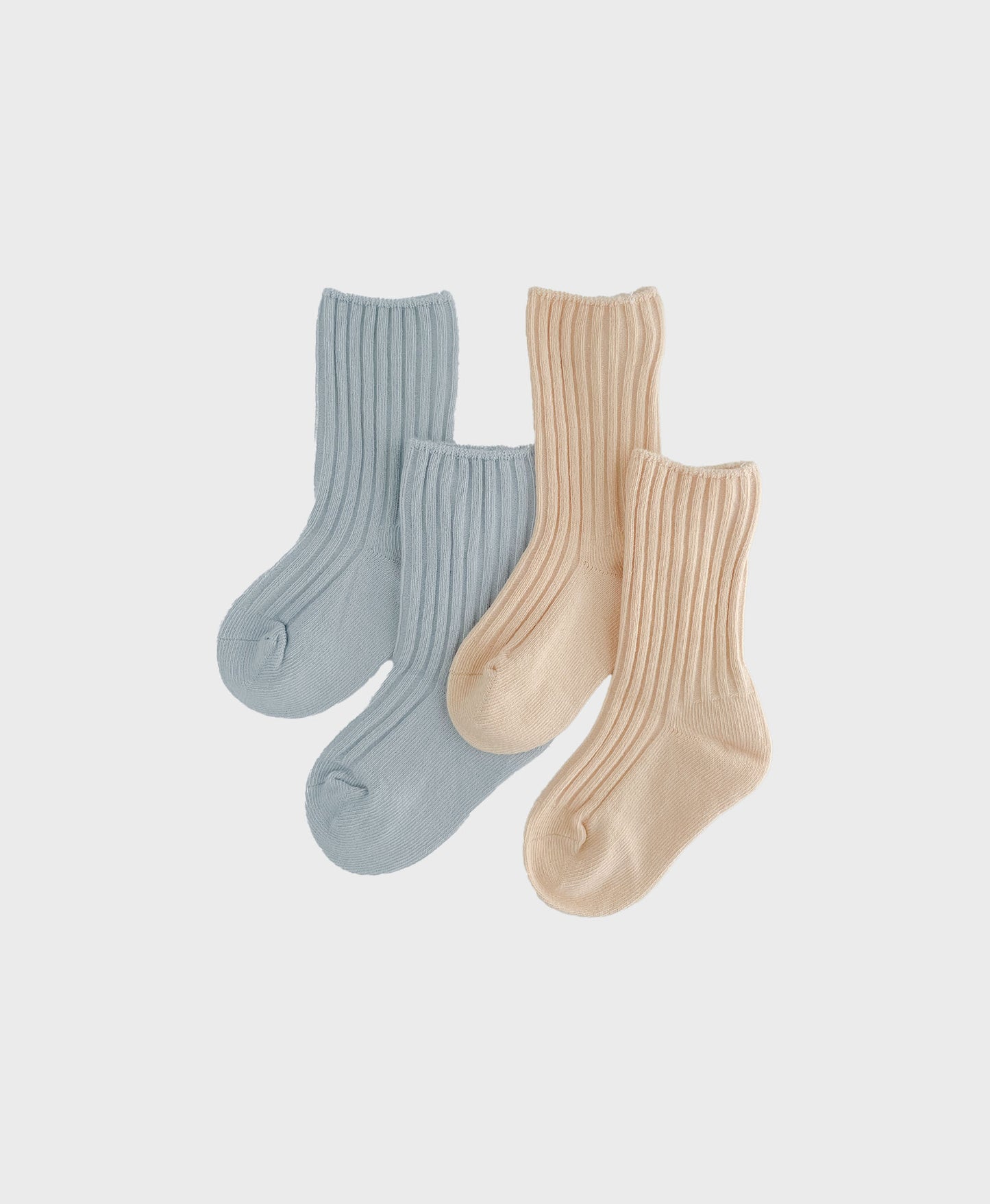 Two pairs of baby socks in blue and apricot. Affordable Luxury - Combed Cotton baby Socks - Matching baby and toddler outfits.