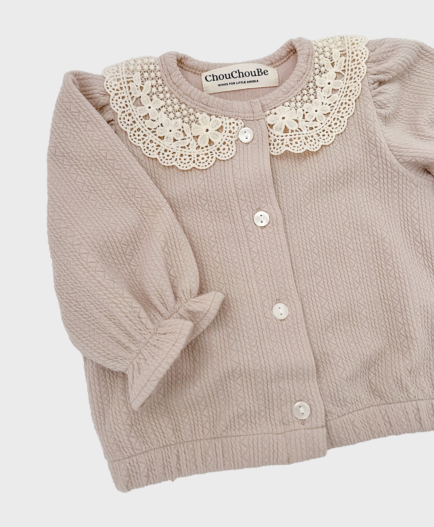 light beige baby cardigan suit set adorned with a white lace collar, suitable for fall and fashionable baby girl clothing.