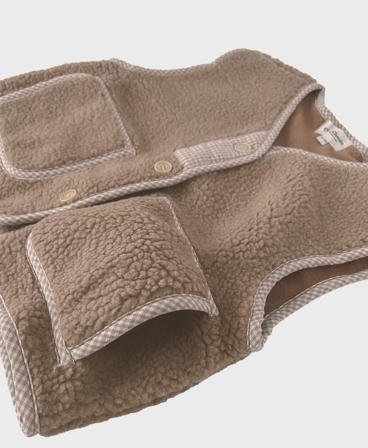 Brown cozy baby vest made of soft fleece, showcasing front pockets, perfect for baby boy boutique clothing and trendy baby clothes boy