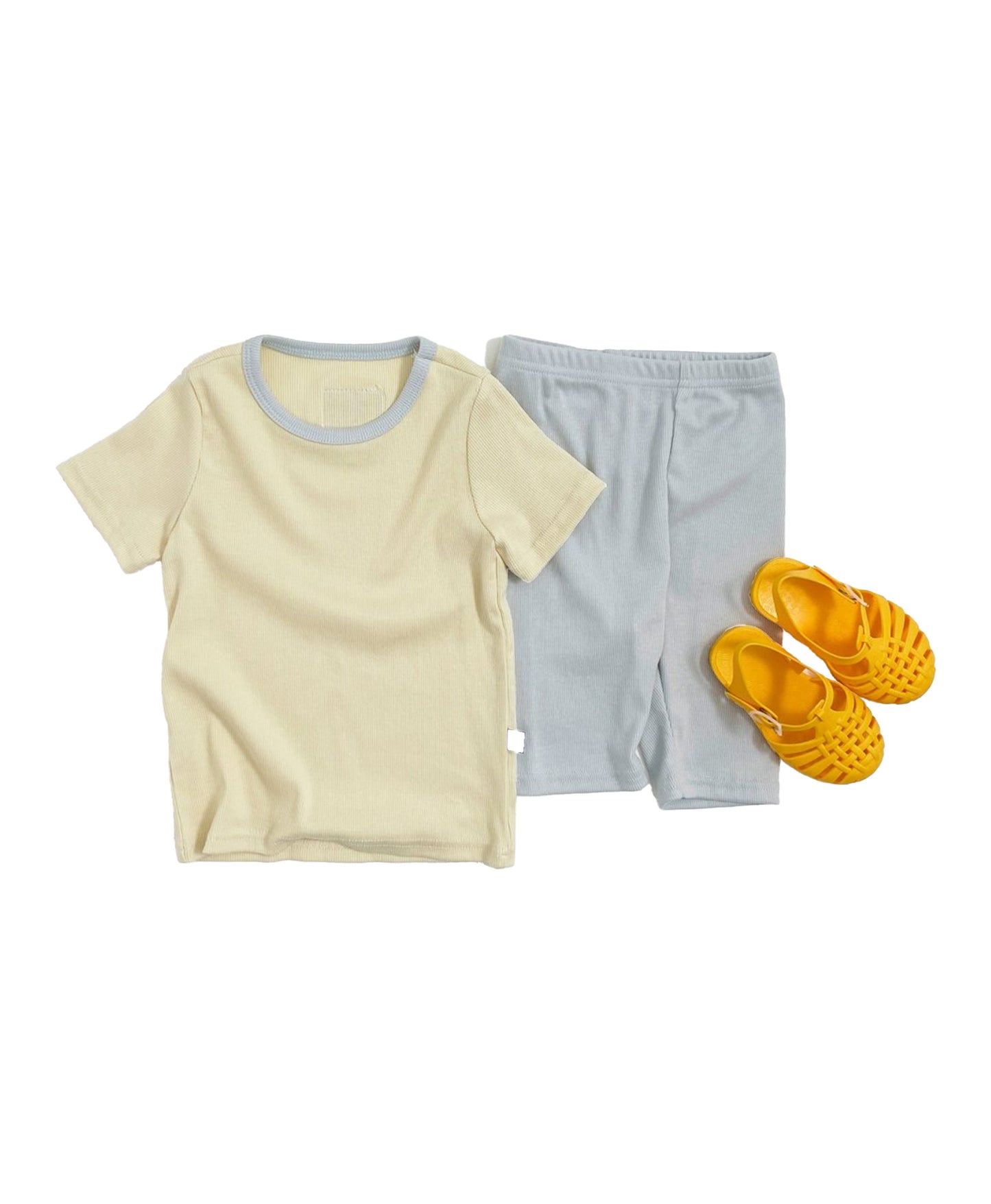 Minimalist baby and toddler matching outfits featuring neutral tees and pants