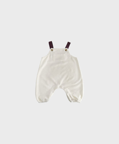 Ivory sleeveless overall with brown straps for hip baby boy with snap buttons.