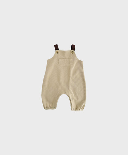 Beige sleeveless overall with brown straps for hip baby boy with snap buttons.