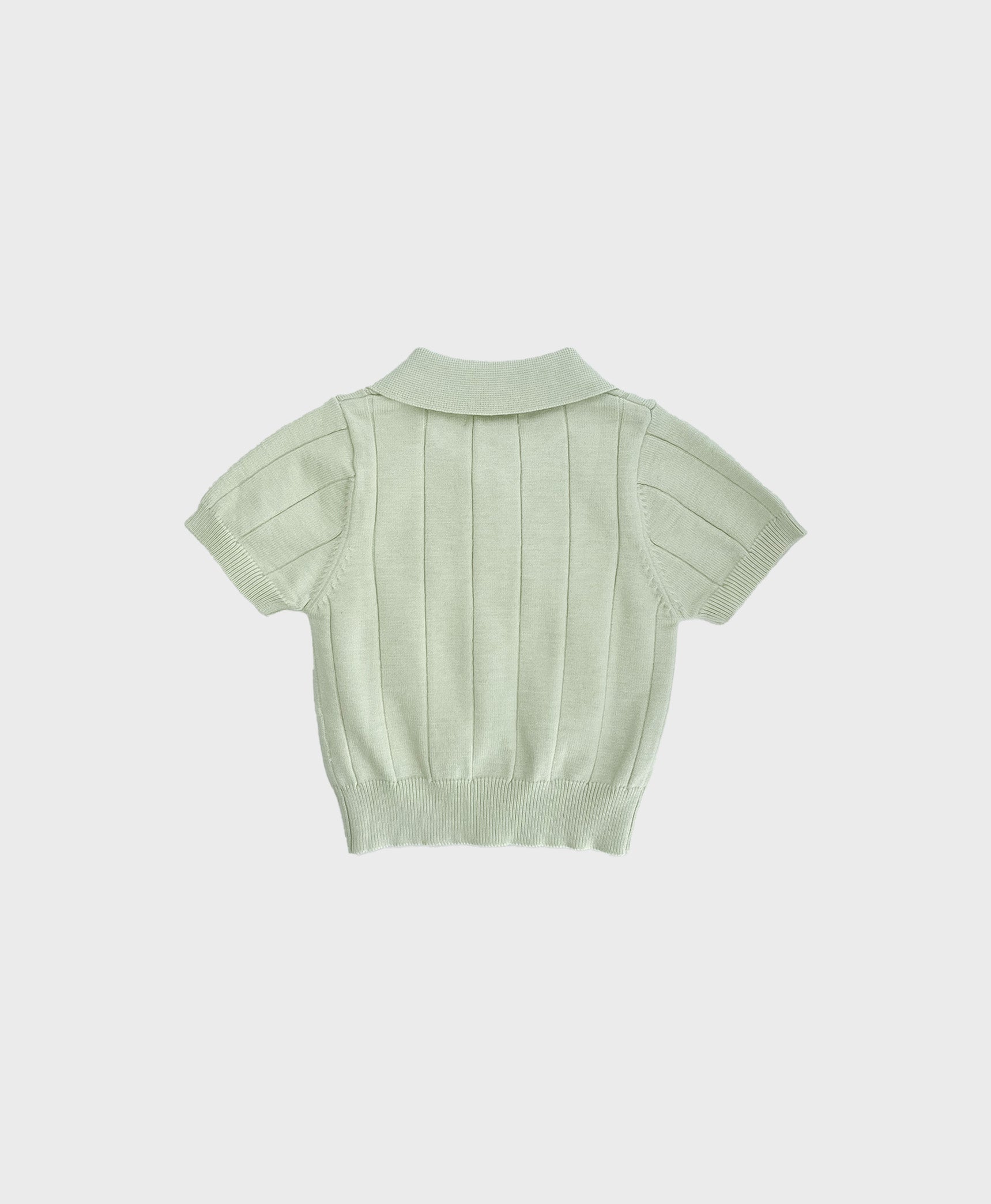 Baby sweater polo in pastel green, featuring a collar. A stylish choice for formal baby boy clothes.