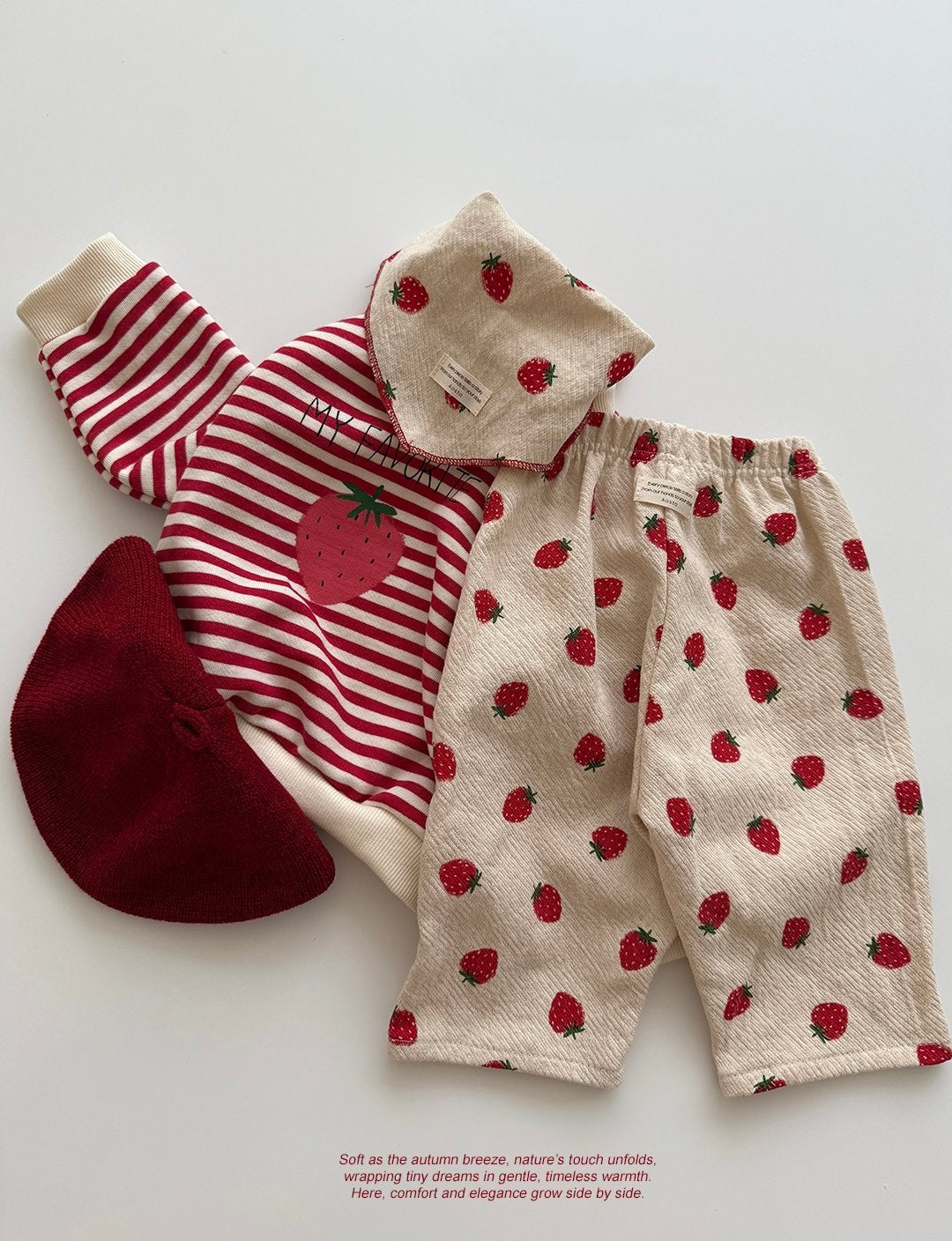 Baby and toddler outfit with red and white striped shirt, red hat, and beige pants with strawberry pattern