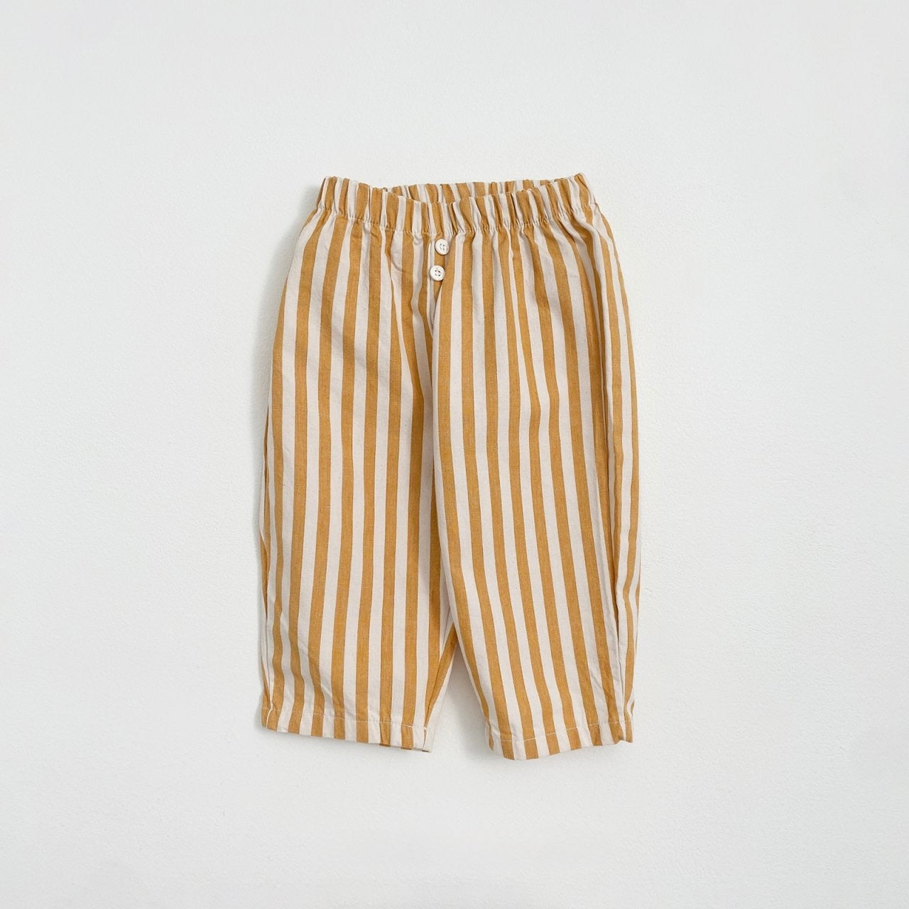 Yellow Striped toddler's pants with a button detail