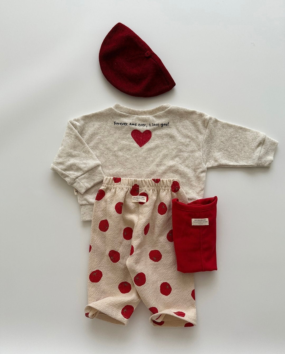 Baby outfit set with long-sleeve shirt, tomato dot pants, red hat