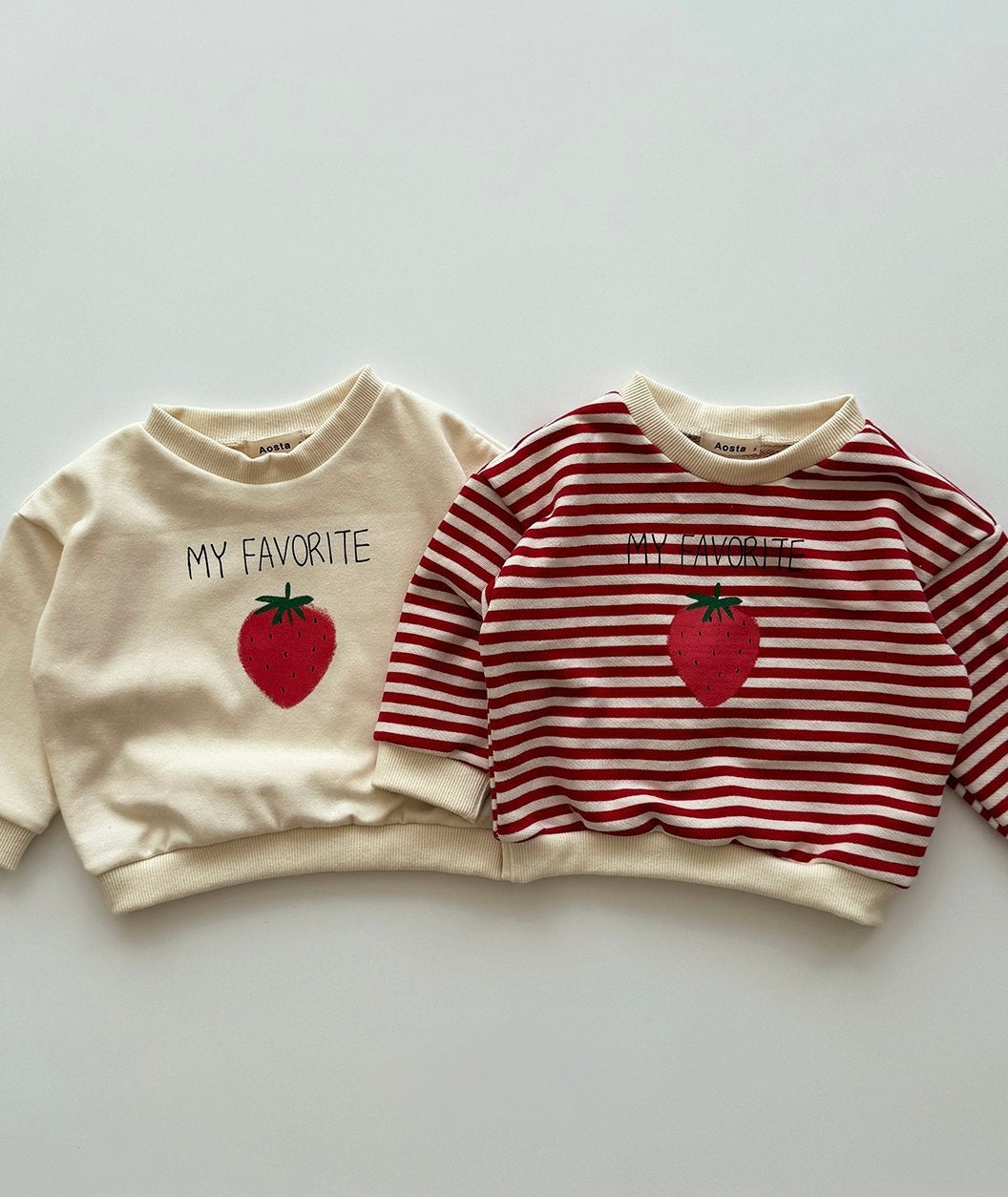 Two baby toddler sweatshirts with strawberry designs