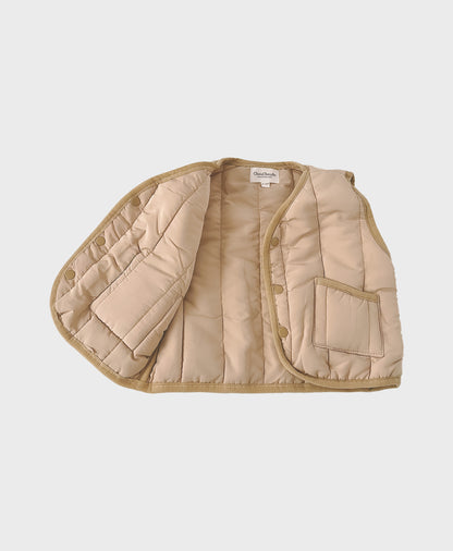 Beige baby windproof quilted puffer vest featuring front pockets for trendy baby clothes boy and hip baby boy clothing