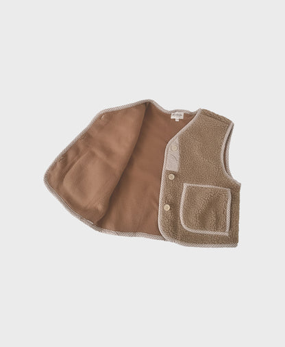 Brown cozy baby vest made of soft fleece, showcasing front pockets, perfect for baby boy boutique clothing