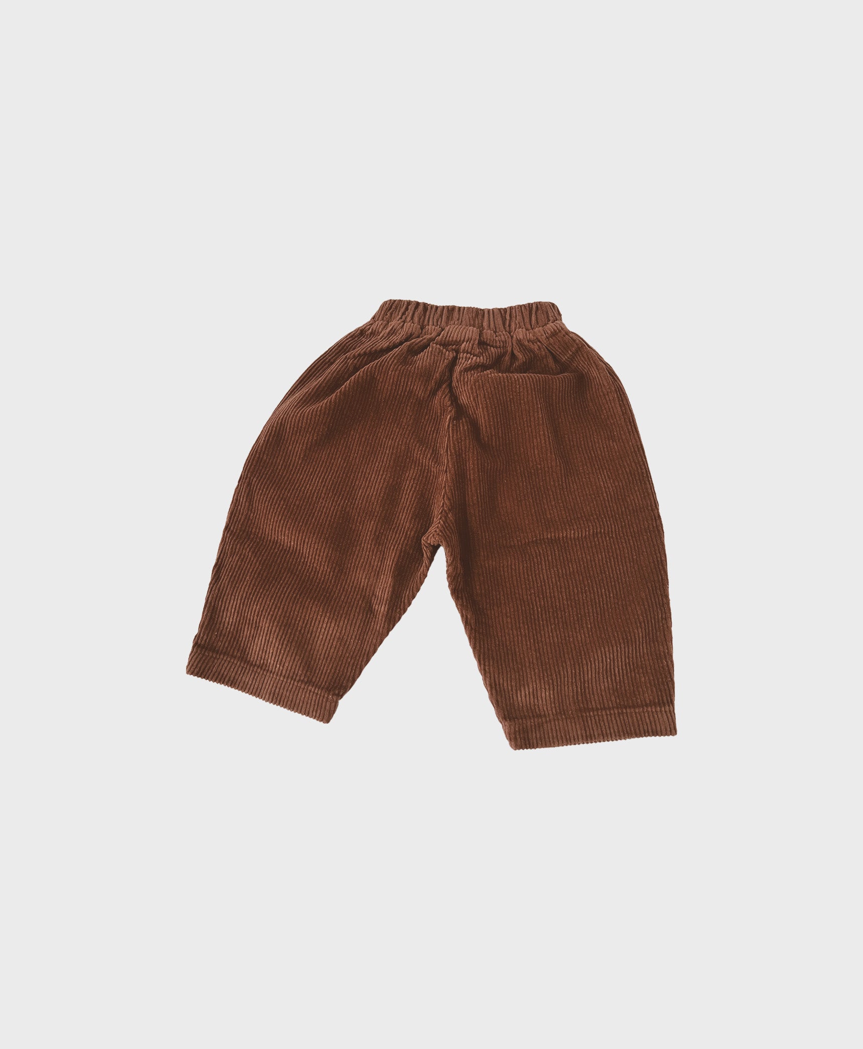 Brown baby corduroy pants with large front pockets, designed for comfort and trendy baby clothes boy