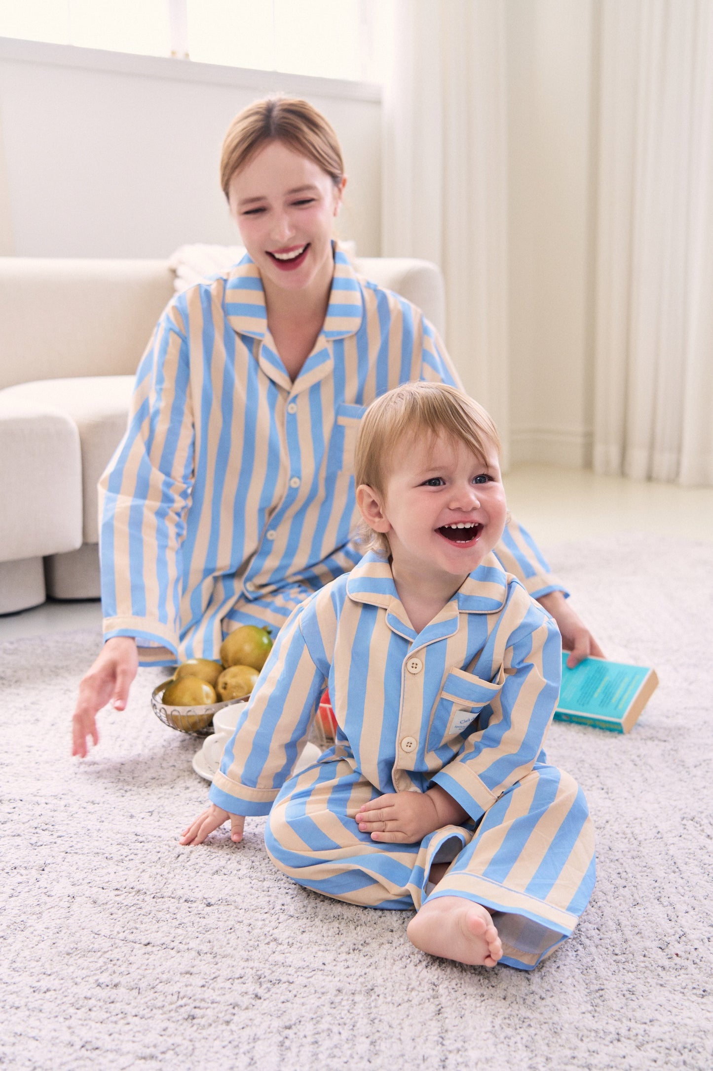 Mother and son wearing matching pajamas in cool colors, perfect for cozy nights in