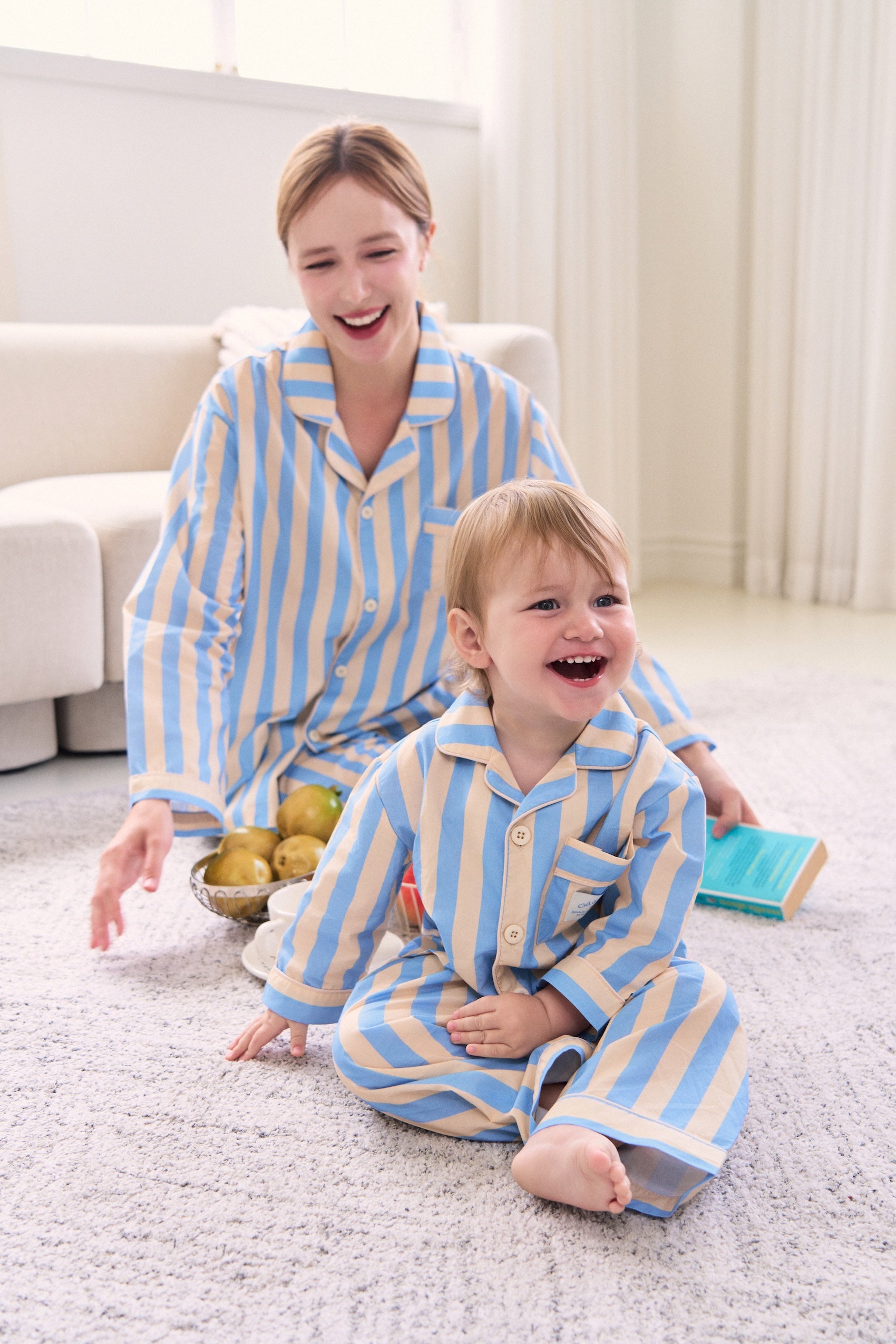 Mother and son wearing matching pajamas in cool colors, perfect for cozy nights in
