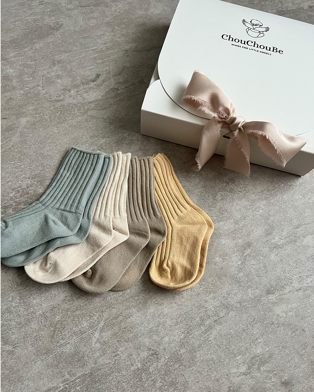 Combed cotton baby socks in assorted colors, sold in sets of five pairs. Perfect for coordinating with baby and toddler attire.