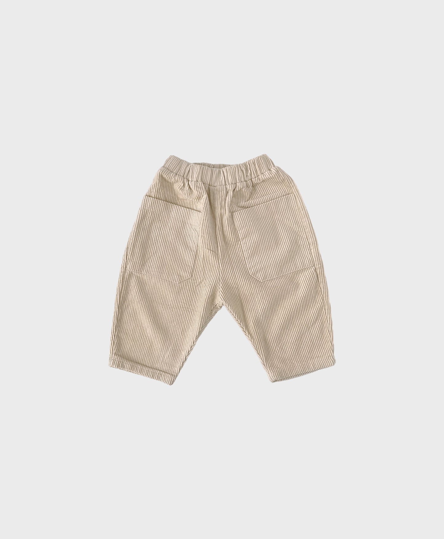 Creme baby corduroy pants featuring spacious front pockets for added convenience and style for baby boy dedication clothes