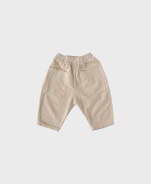 Creme baby corduroy pants featuring spacious front pockets for added convenience and style for baby boy dedication clothes