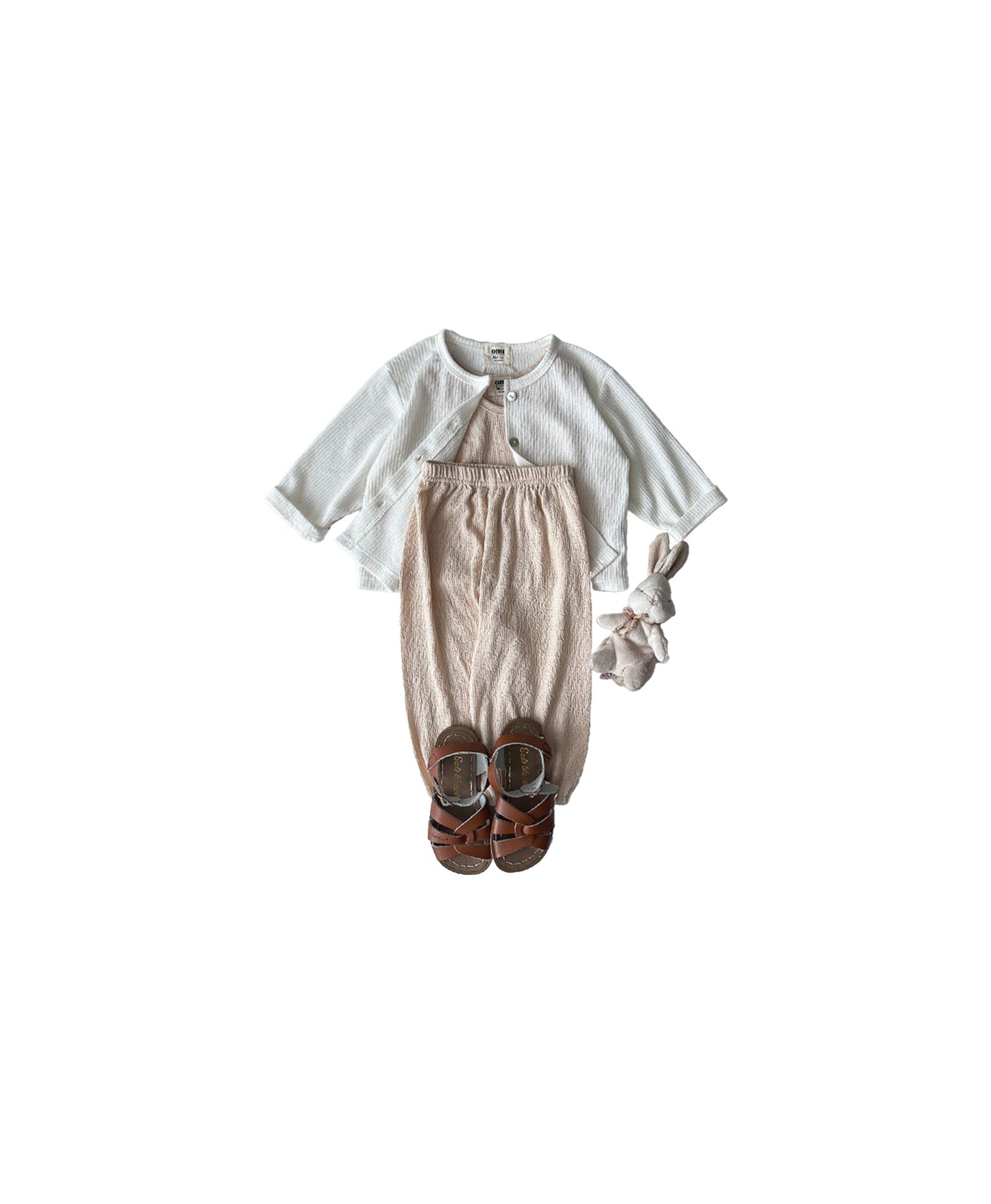 Cardigan outfit in soft tones, representing cool baby boy clothes with a fashionable edge