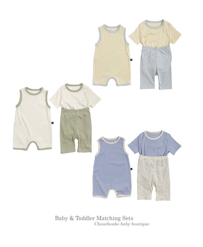Toddler and baby wearing matching outfits sets in various colors