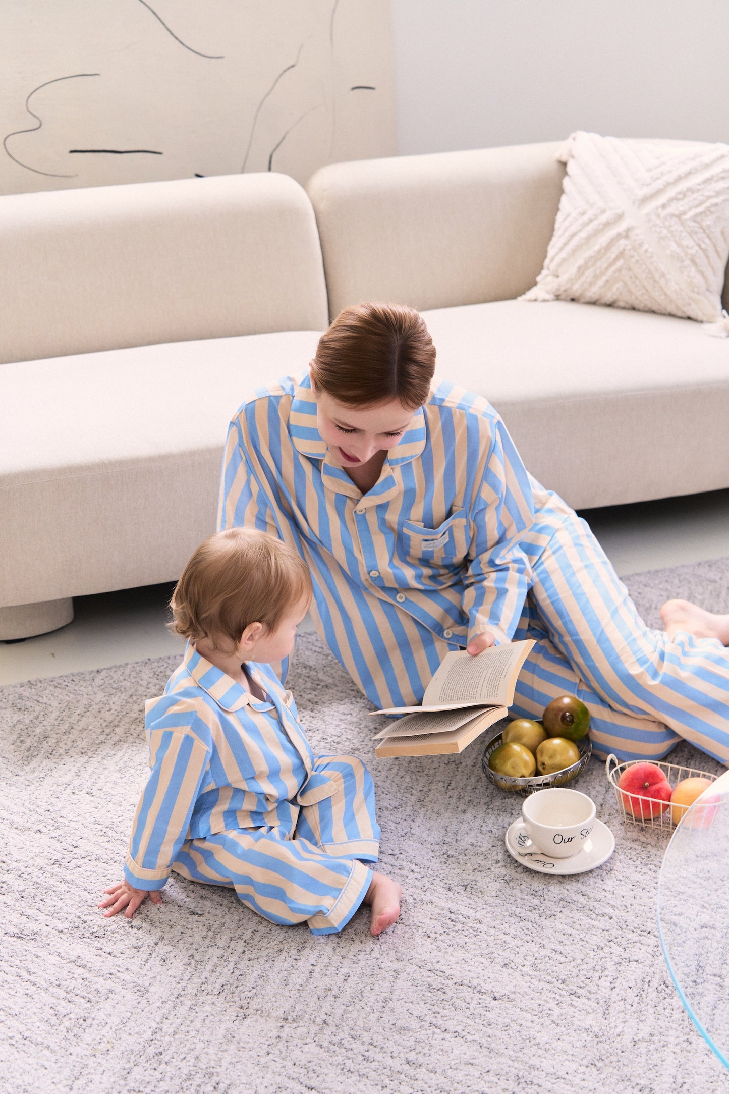 Mom wearing cozy pajamas from a mommy and me pajamas matching set, perfect for bedtime bonding