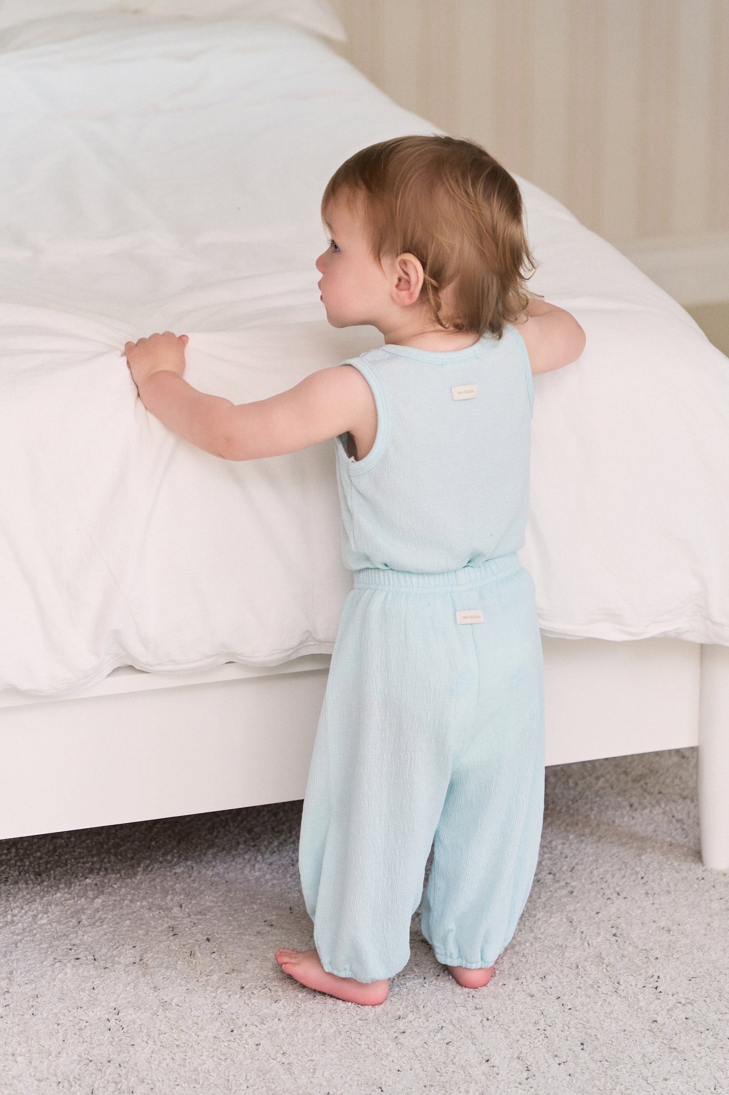Cool baby boy clothes set with a neutral blue cotton tee, and stretch-waist pants