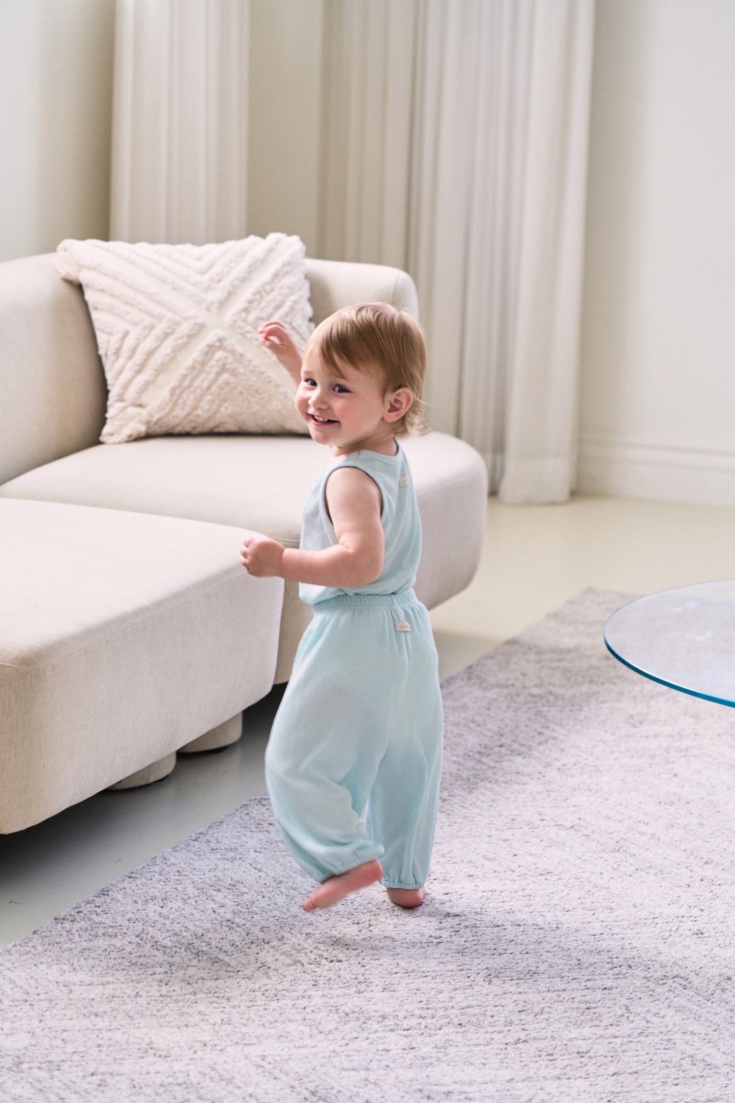cool baby boy clothes set with breathable fabric and a clean playing in the room
