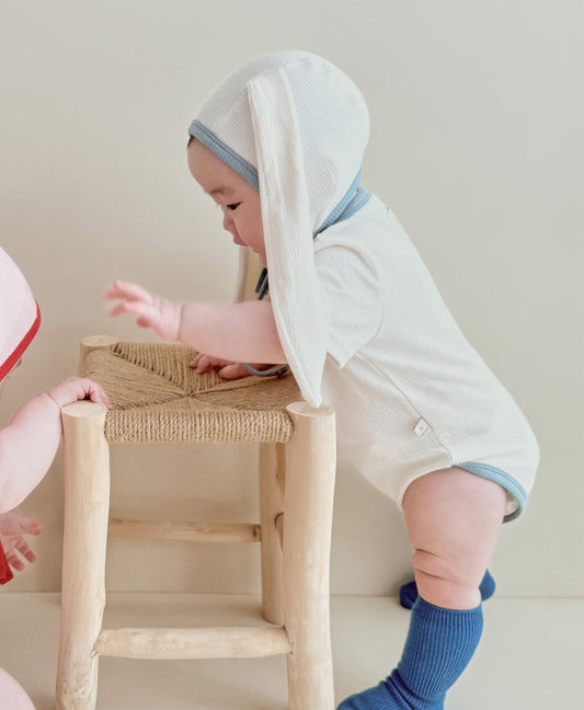 baby wearing one of the best baby onesies