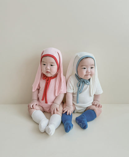 Smiling baby wearing one of the best baby onesies